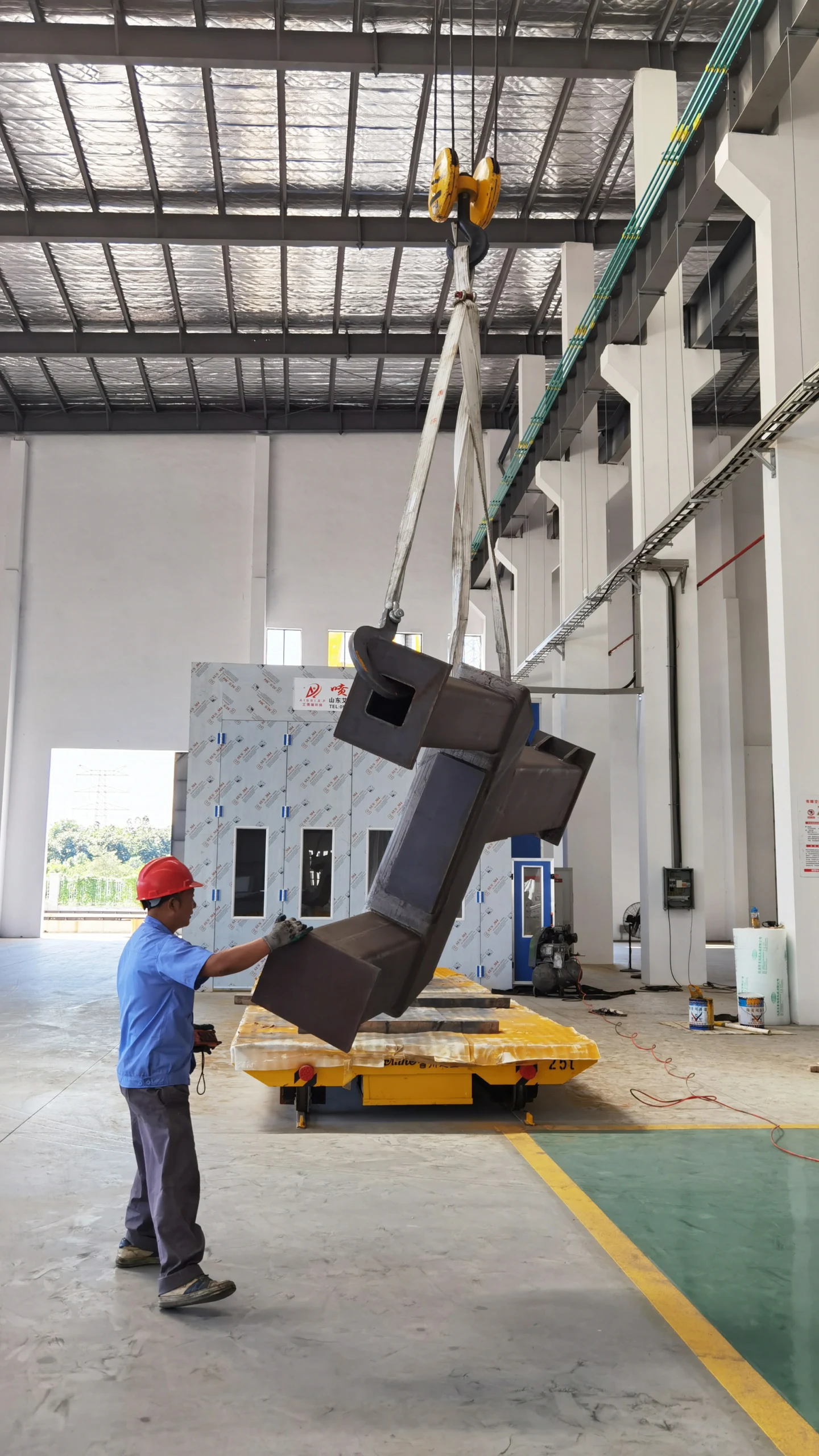 Rail Flatcar Transporting Components Inside Spray Booth